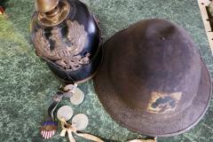 One of our several painted 102nd Regiment helmets and a German helmet